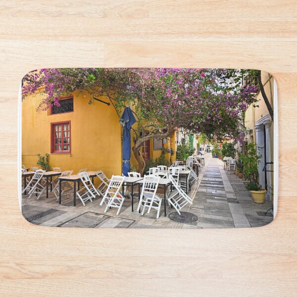 Item preview, Restaurant and houses in the narrow streets of Nafplion town with Bougainvillea flowers designed and sold by goceris.