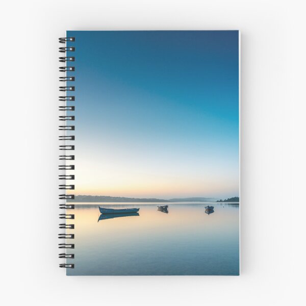 Item preview, Lagoon sunrise, serene water with small boats reflections and clear blue sky designed and sold by jpferreiraphoto.