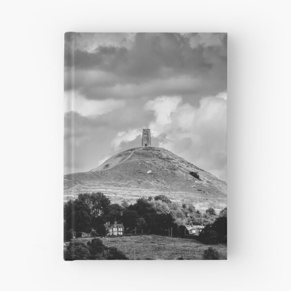 Item preview, St. Michael's Tower atop Glastonbury Tor, dramatic sky above. designed and sold by bailey-cooper.