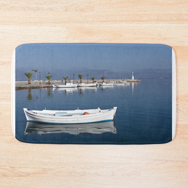 Item preview, White boats and blue sea in the harbor Nafplio Greece designed and sold by goceris.