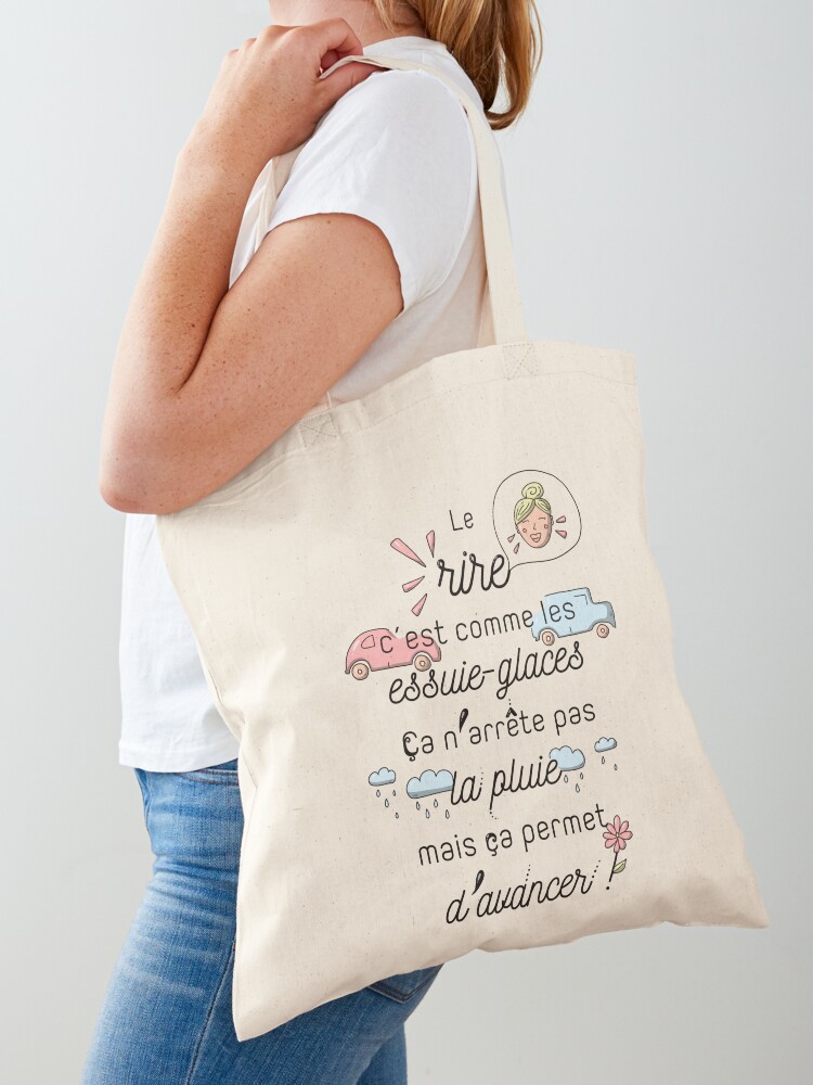 Aperçu 1 sur 5. Tote bag avec l'œuvre Citation : Le rire c'est comme les essuie-glaces créée et vendue par GribouillStreet.