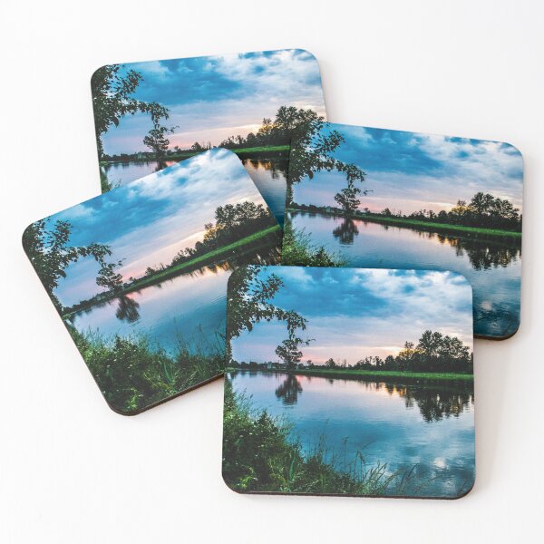 Item preview, An image of a vibrant sunset over a serene lake, with colorful reflections shimmering on the water designed and sold by stemoir.