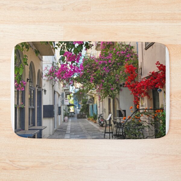 Item preview, Restaurant and buildings in the narrow streets of Nafplion town with Bougainvillea flowers designed and sold by goceris.