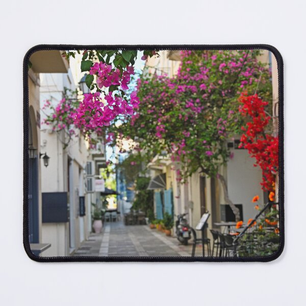 Item preview, Restaurant and buildings in the narrow streets of Nafplion town with Bougainvillea flowers designed and sold by goceris.