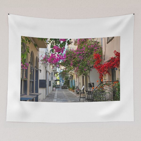 Item preview, Restaurant and buildings in the narrow streets of Nafplion town with Bougainvillea flowers designed and sold by goceris.