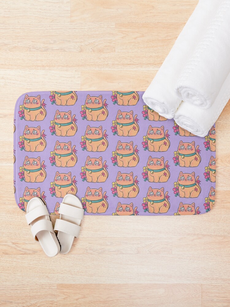 Discover Cute orange chubby kitten with flowers | Bath Mat