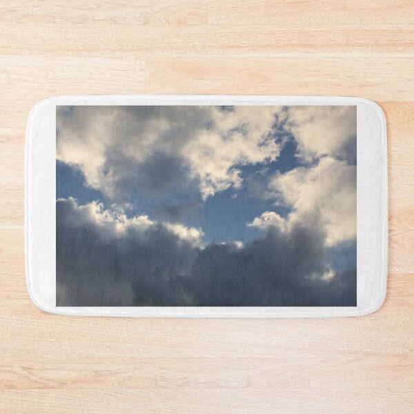 Item preview, Clouds in a blue sky reflecting the orange sun designed and sold by EwanP123.
