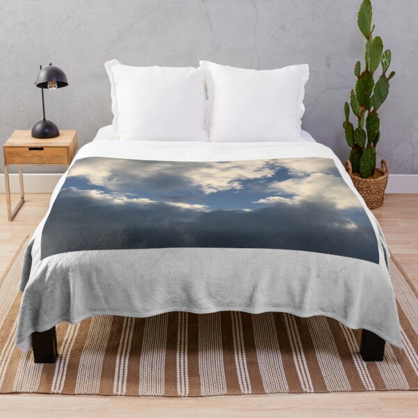 Item preview, Clouds in a blue sky reflecting the orange sun designed and sold by EwanP123.