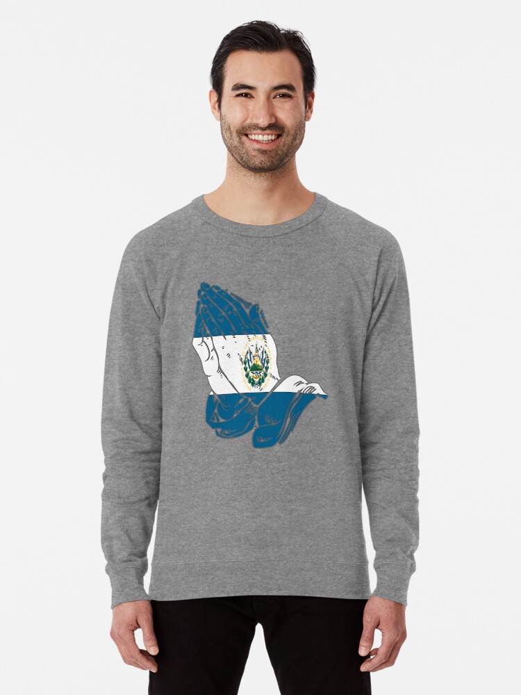 sudadera con manos rezando
