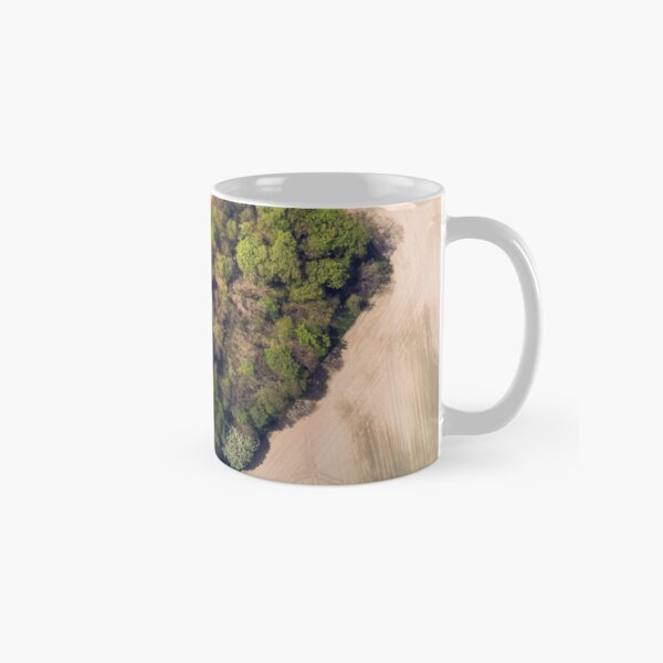 Heart-shaped green grove among a field of grain Classic Mug