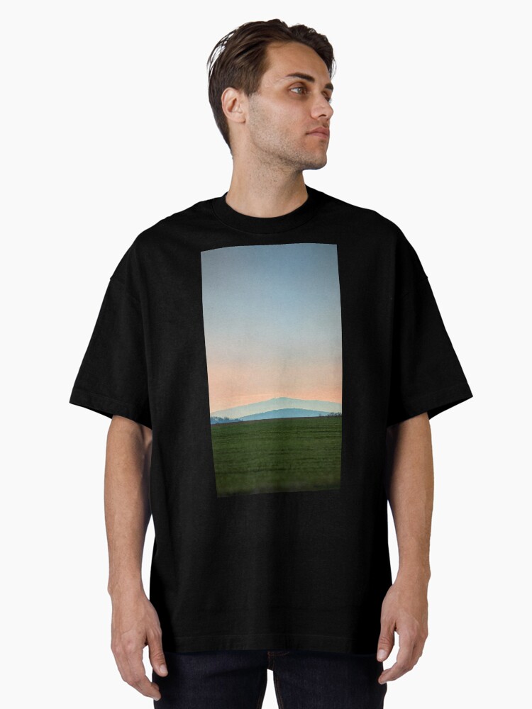 Thumbnail 1 of 7, Oversized T-Shirt, view of the mountain against the backdrop of the setting sun designed and sold by picdab-com.