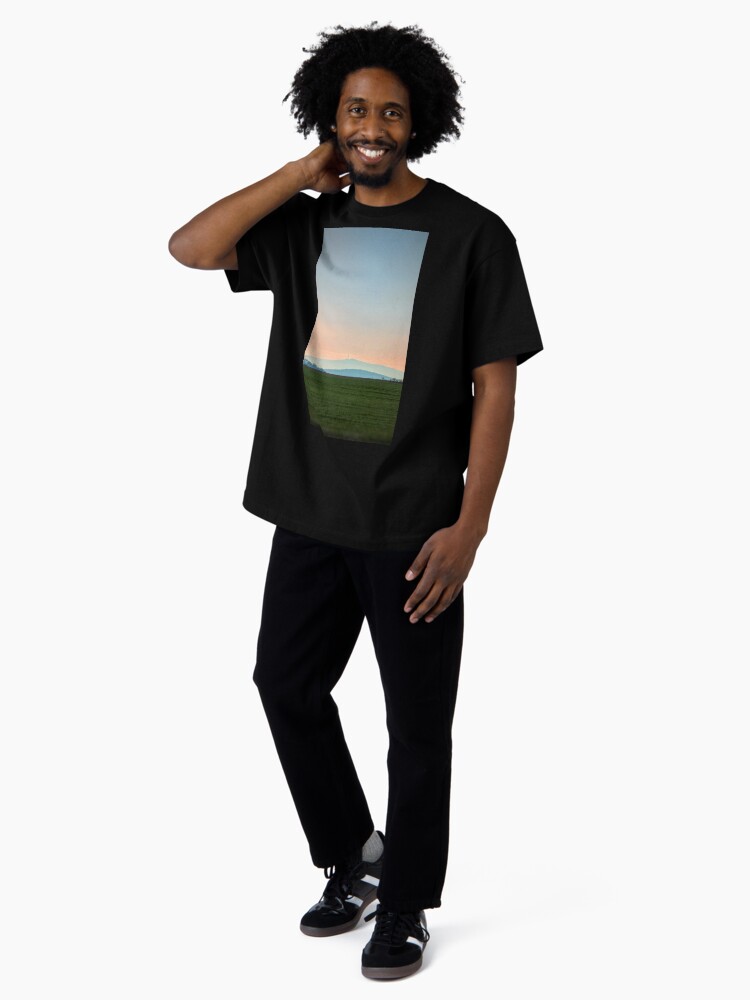 Thumbnail 4 of 7, Oversized T-Shirt, view of the mountain against the backdrop of the setting sun designed and sold by picdab-com.