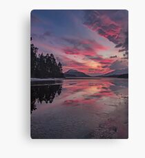 Sunset over frozen Loch Laggan, Scotland. Canvas Print