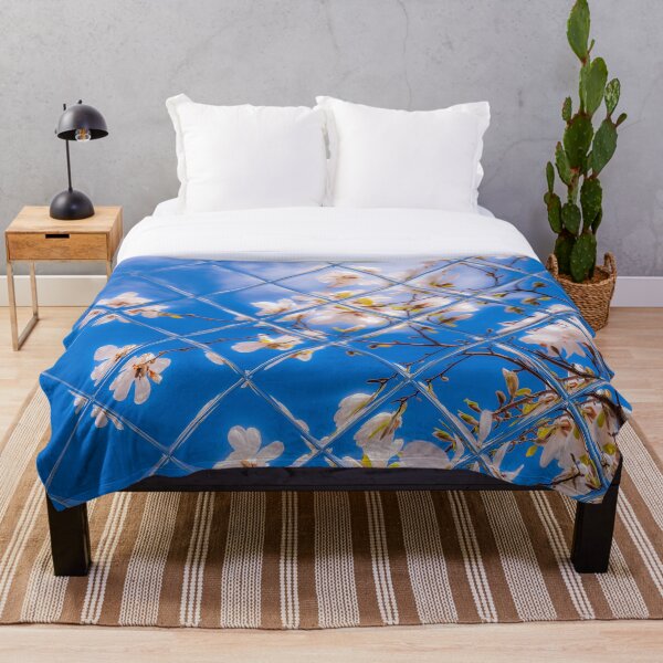 Item preview, White Magnolia shining with Sunlight and shouting all the energy of Spring into the blue sky designed and sold by goodspringsshop.