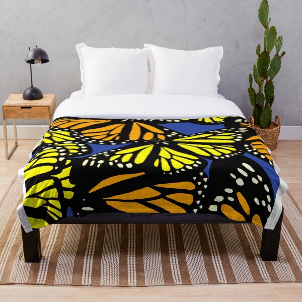 Item preview, Orange and yellow Monarch Butterflies flying bright blue background designed and sold by WildCanyon.