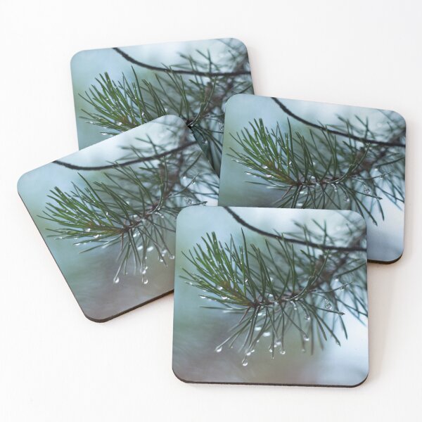 Item preview, Pine branch with water drops on a blurred background of pine needles designed and sold by LiubovAvdeeva.