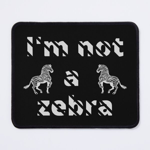 Item preview, I'm not a zebra. White letters with a mask in the shape of diagonal stripes and two black and white zebras designed and sold by SplashTastic.