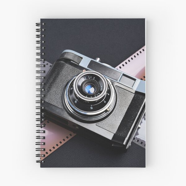 Item preview, Vintage camera and films on black designed and sold by Ryzhov.
