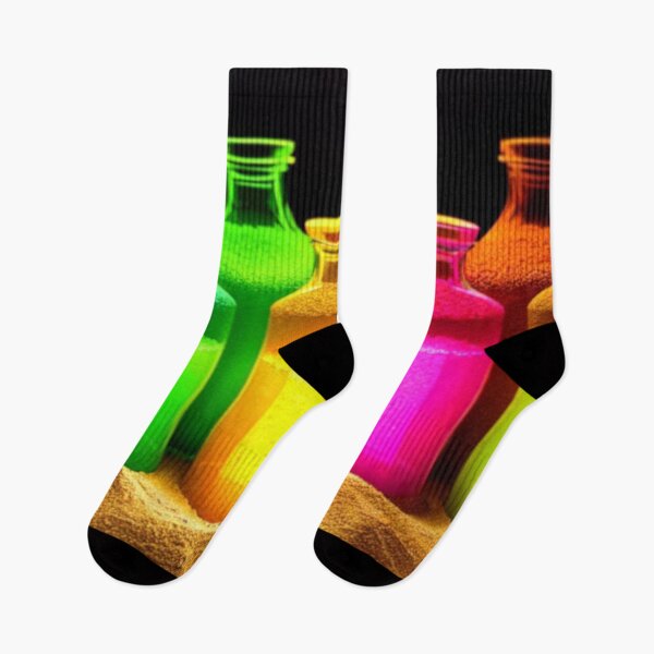 Item preview, Colorful bottles in the sand on a black background. Beautiful and elegant designed and sold by BRINDELEGARD.