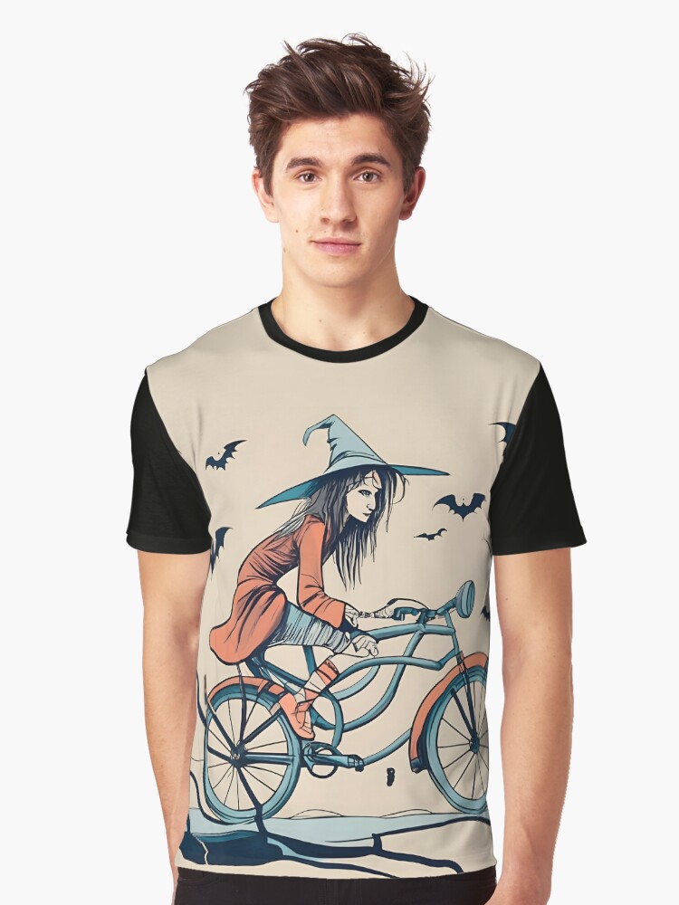 Thumbnail 1 of 5, Graphic T-Shirt, Halloween Witch on a bicycle designed and sold by Patricks-Art.