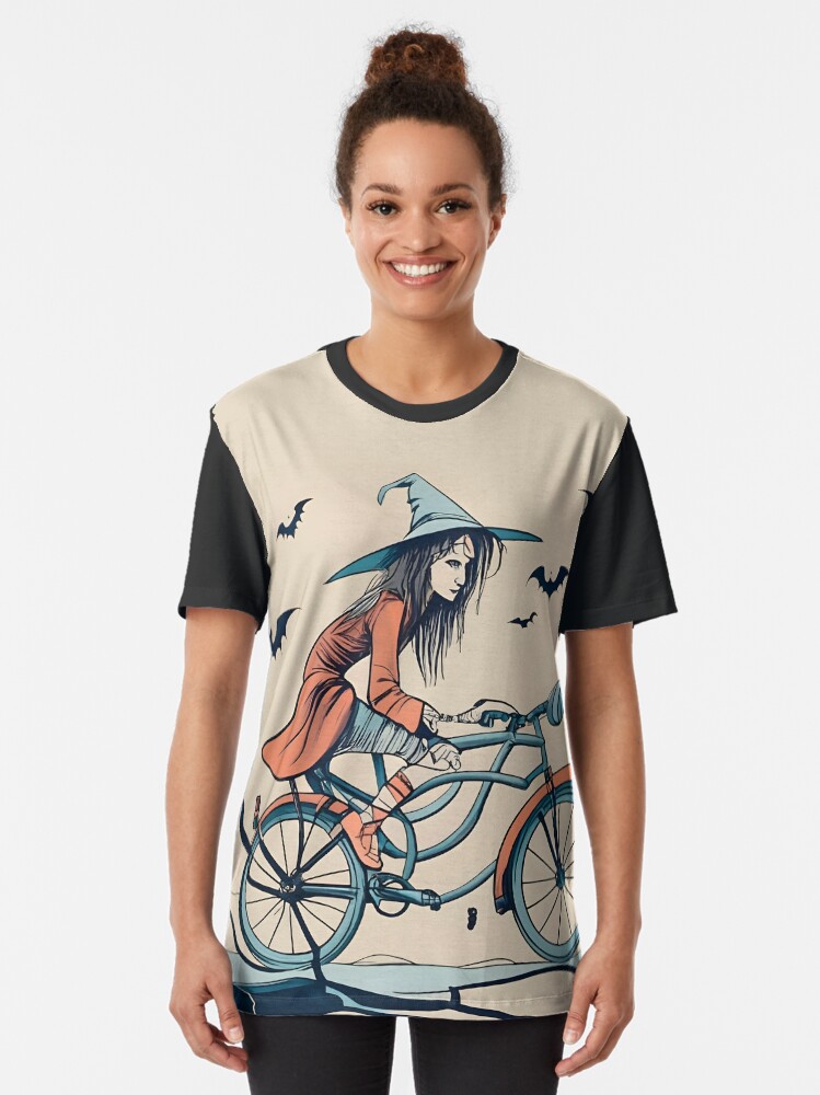 Thumbnail 2 of 5, Graphic T-Shirt, Halloween Witch on a bicycle designed and sold by Patricks-Art.