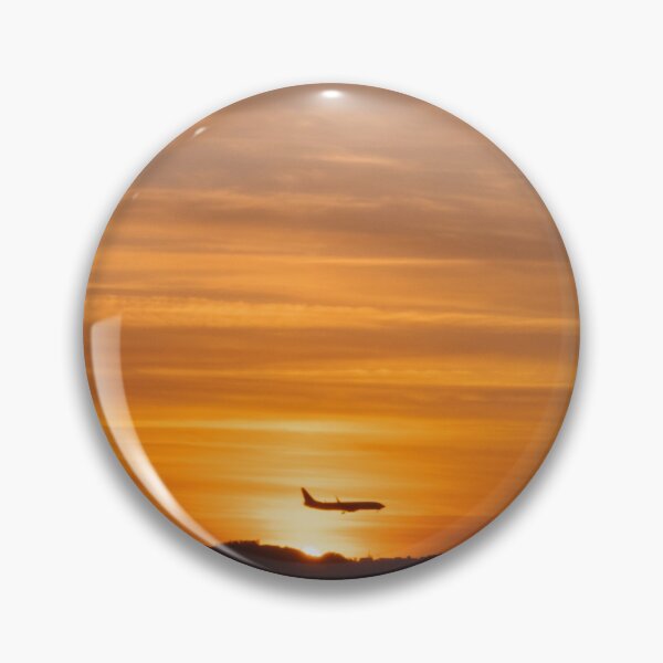 Item preview, Avión volador sobre el fondo de un cielo colorido y naranja al atardecer. designed and sold by tiny-prism.