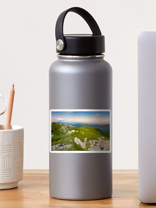 Thumbnail 1 of 3, Sticker, boulders on a grassy slopes of Runa mountain designed and sold by mike-pellinni.