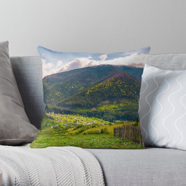 village in valley on a cloudy springtime day Throw Pillow