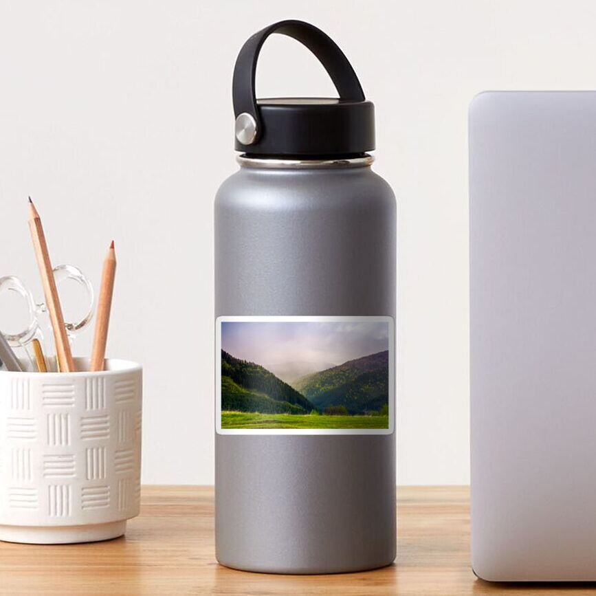 mountains on a cloudy springtime day Sticker