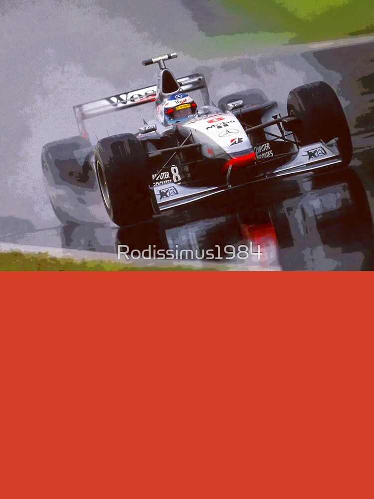 Mika Hakkinen racing his 1998 MP4 13 F1 racecar in the rain