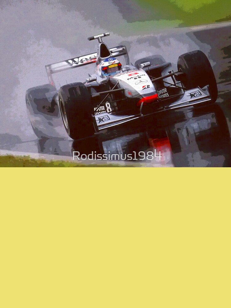 Mika Hakkinen racing his 1998 MP4 13 F1 racecar in the rain