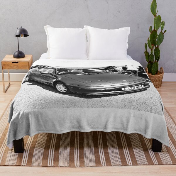 Item preview, Black and white image of the front of a blue Lotus Elan, 1990 on display  designed and sold by Graham Cornall.