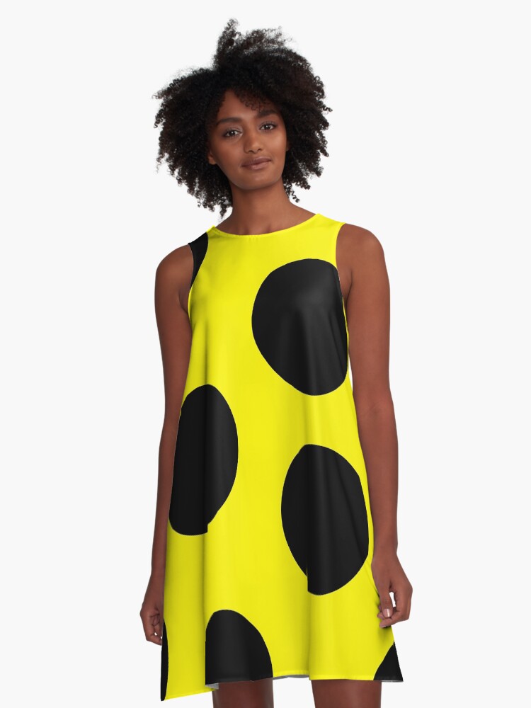 yellow dress with black spots