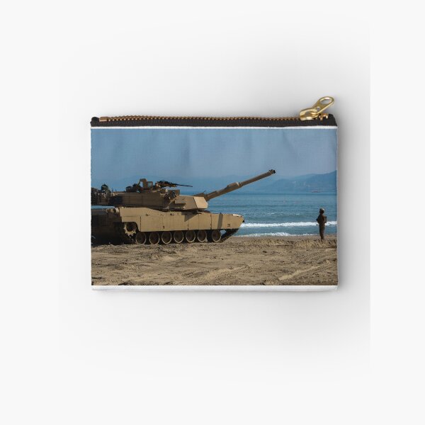 Item preview, STK109839M-U.S. Army Soldier guides an M1A1 Abrams Main Battle Tank on the beach. designed and sold by StocktrekImages.