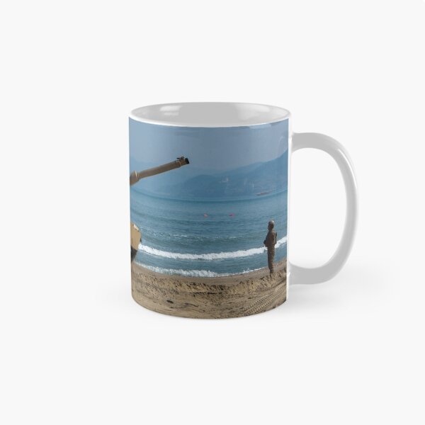 Item preview, STK109839M-U.S. Army Soldier guides an M1A1 Abrams Main Battle Tank on the beach. designed and sold by StocktrekImages.
