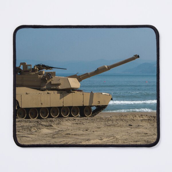 Item preview, STK109839M-U.S. Army Soldier guides an M1A1 Abrams Main Battle Tank on the beach. designed and sold by StocktrekImages.