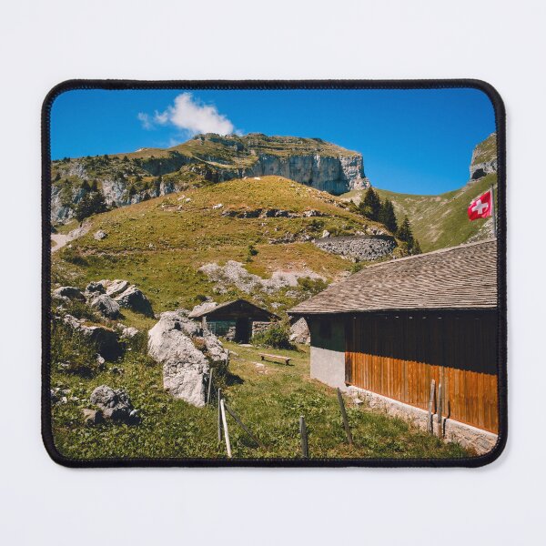 Item preview, Wooden barn and swiss flag in Alpine landscape designed and sold by svanaerschot.