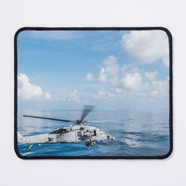Item preview, STK109467M-An MH-60S Sea Hawk helicopter departs the flight deck of USS Essex. designed and sold by StocktrekImages.