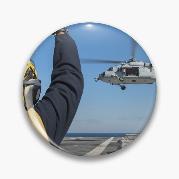 Item preview, STK109427M-Aviation Boatswain's Mate directs an MH-60S Sea Hawk helicopter. designed and sold by StocktrekImages.