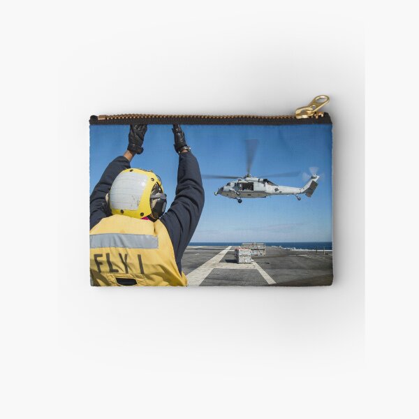Item preview, STK109427M-Aviation Boatswain's Mate directs an MH-60S Sea Hawk helicopter. designed and sold by StocktrekImages.