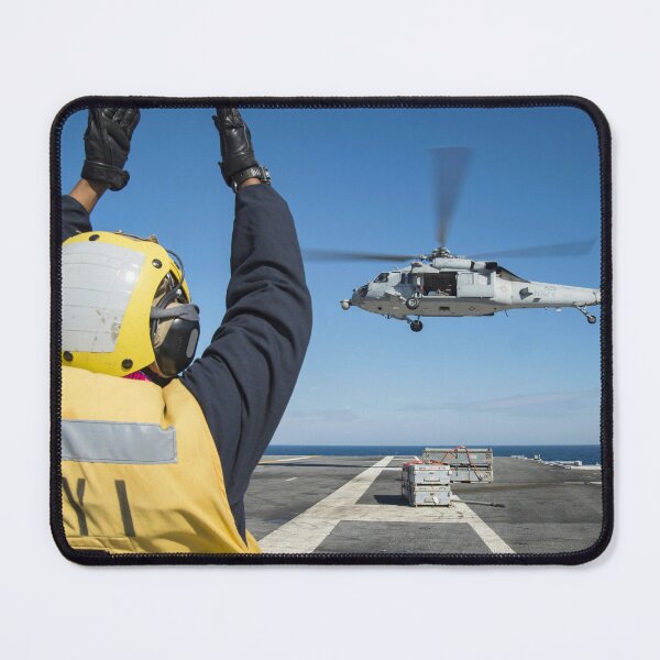 Item preview, STK109427M-Aviation Boatswain's Mate directs an MH-60S Sea Hawk helicopter. designed and sold by StocktrekImages.