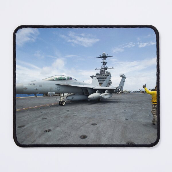 Item preview, STK109298M-Chief Aviation Boatswain's Mate directs an EA-18G Growler. designed and sold by StocktrekImages.