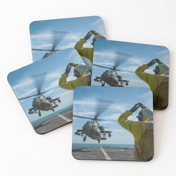 Item preview, STK109197M-Boatswain's Mate signals an AH-64 Apache helicopter aboard USS Fort McHenry. designed and sold by StocktrekImages.