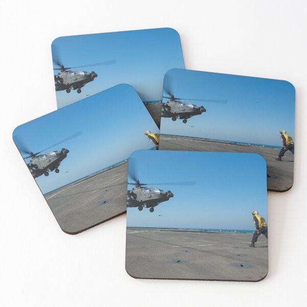 Item preview, STK109149M-Boatswain's Mate signals an Apache helicopter on the flight deck of USS Comstock. designed and sold by StocktrekImages.