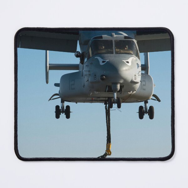 Item preview, STK109053M-Marines attach the hoist sling of an AV-8B Harrier jet engine container to an MV-22 Osprey. designed and sold by StocktrekImages.