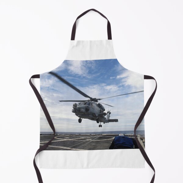Item preview, STK109030M-Seaman prepares to secure a helicopter to the flight deck aboard USS Vicksburg. designed and sold by StocktrekImages.