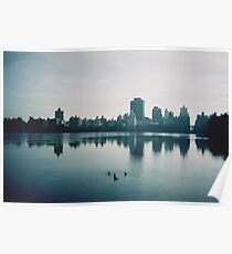 Film photo of Central Park, New York City, with its lake and surrounded buildings Poster