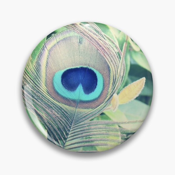Item preview, Vibrant Peacock Feather In Front of Green Leaves designed and sold by emscaroline.