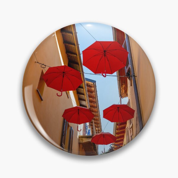 Item preview, City Street in Porto Ceresio with Hanging Umbrellas in a Sunny Summer Day designed and sold by Mats Silvan.