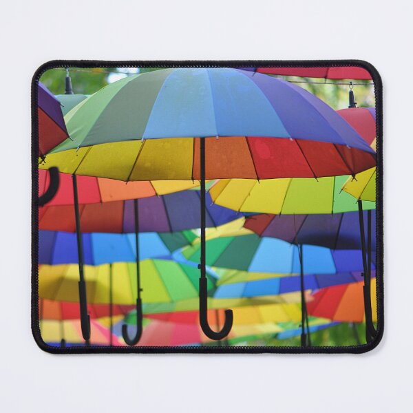 Item preview, A collection of rainbow umbrellas strung up and flying  designed and sold by IPPhotography.